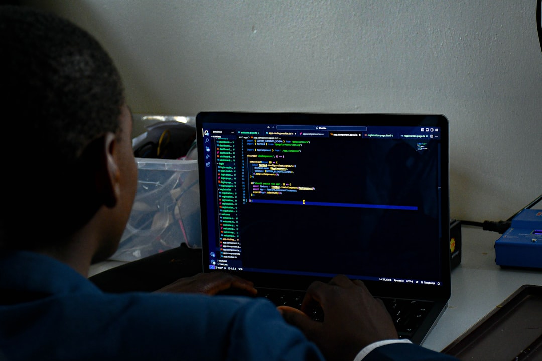 A person writing a computer code.